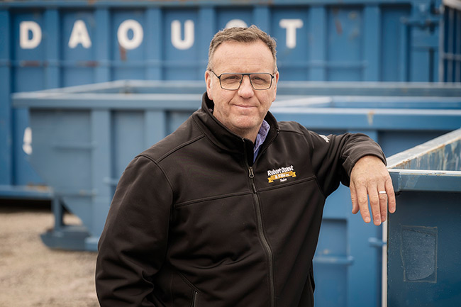 Supervisor standing in front of containers